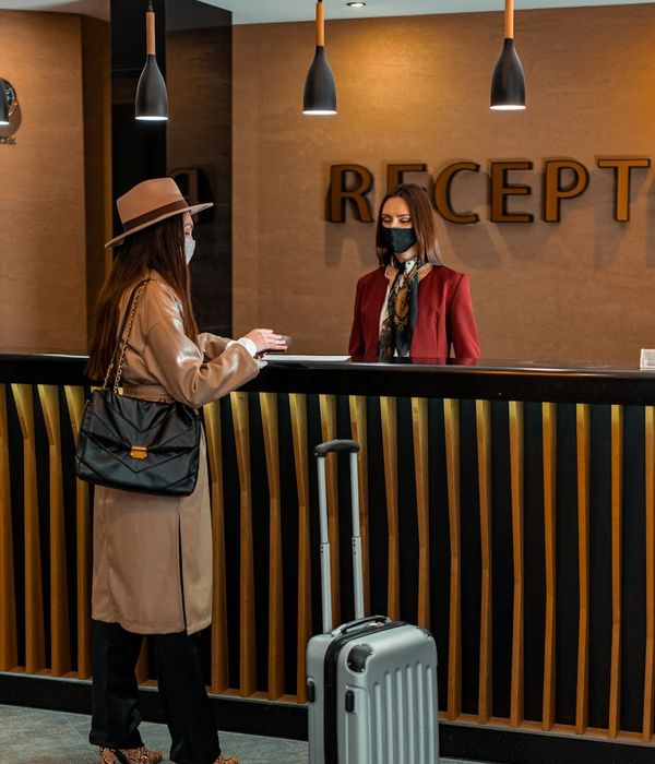 Friendly customer service representative assisting client with repair inquiry